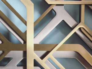 three-layered-laser-cut-screens-in-double-stone-steel-pvd-colored-stainless-steel-champagne-brush-brass-brush-and-powder-coated-stainless-steel-in-bronze